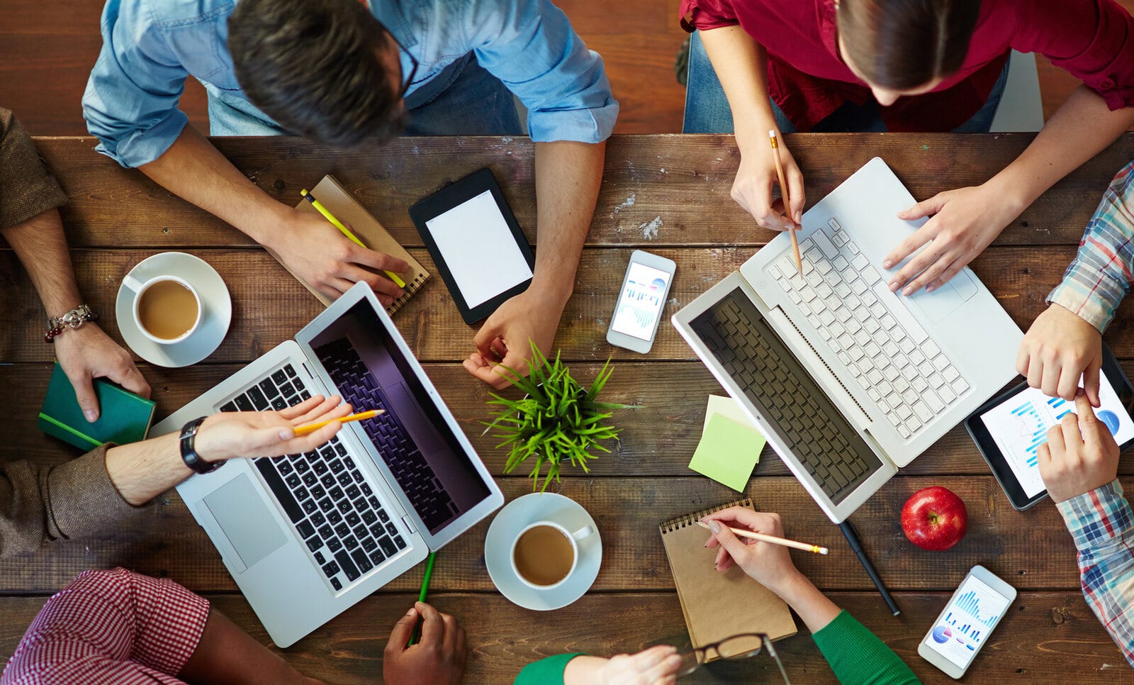 A fundraising team working together around a table